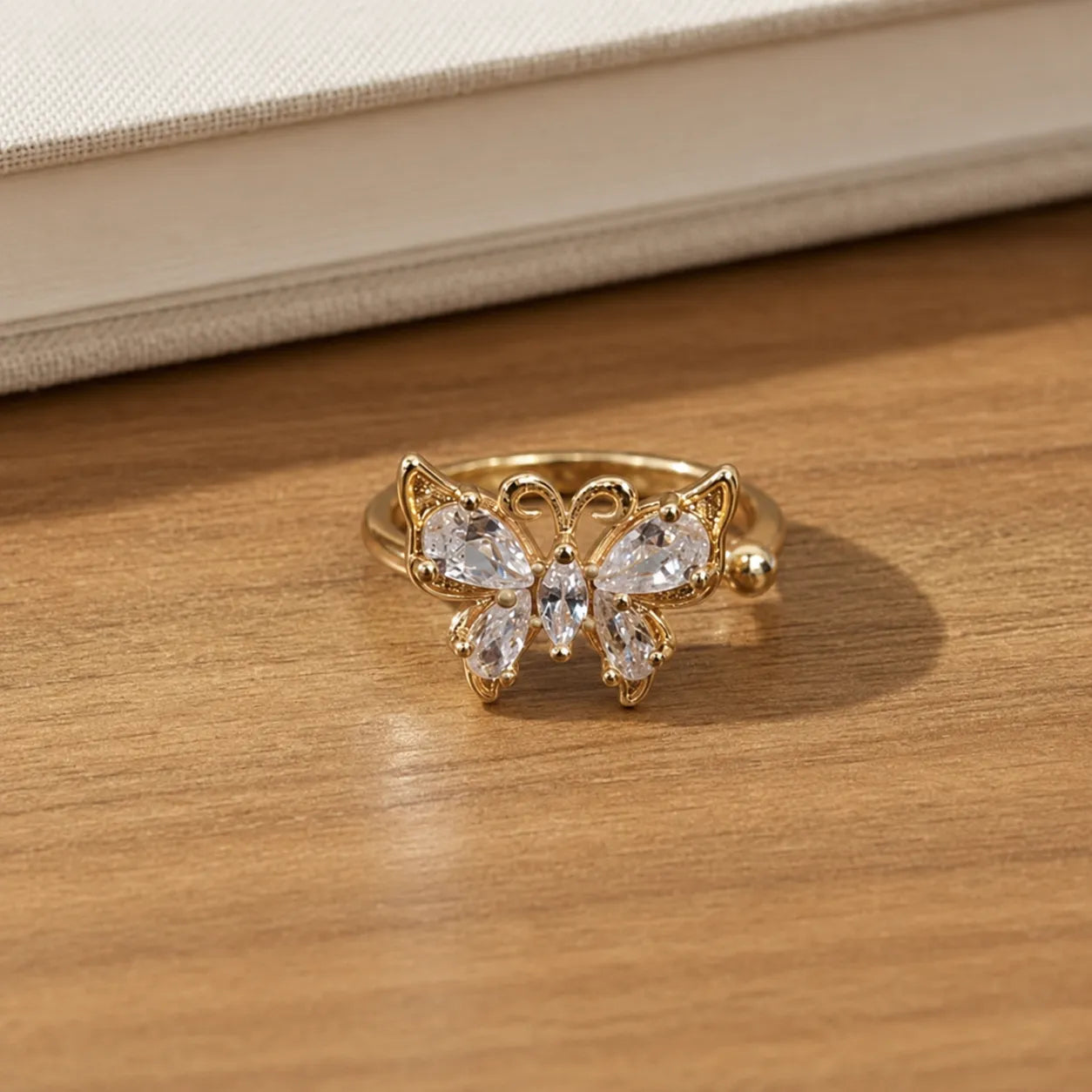 Marvel Silver gold plated adjustable butterfly crystal ring for girls featuring marquise and pear-cut cubic zirconia stones with an elegant open-band design.