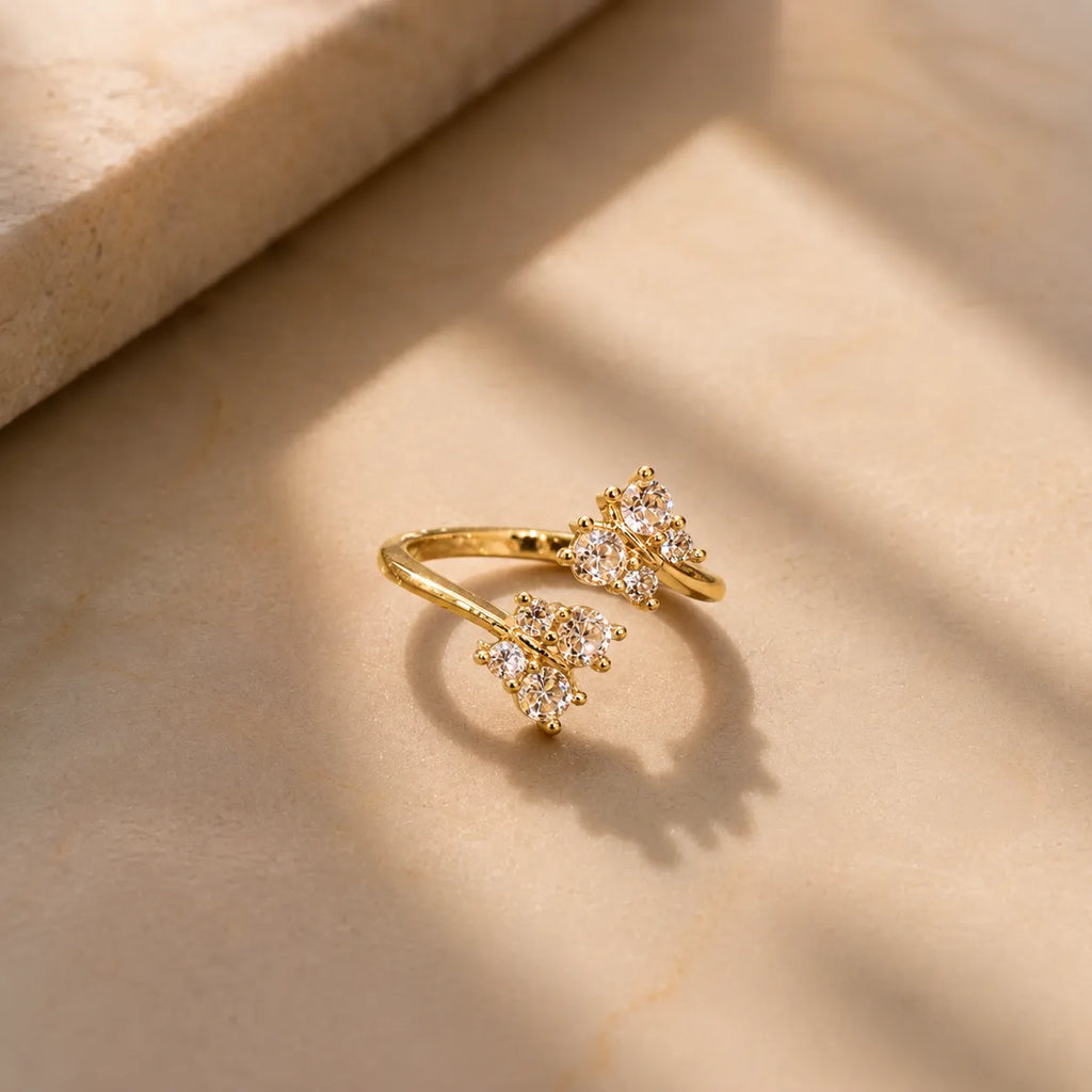 Marvel Silver gold plated adjustable butterfly crystal ring for girls featuring sparkling cubic zirconia stones in an elegant open-band design.