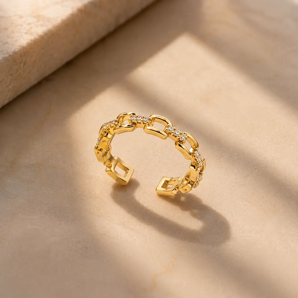 Marvel Silver gold plated adjustable chain link ring for girls featuring sparkling cubic zirconia stones in a modern open-band design.