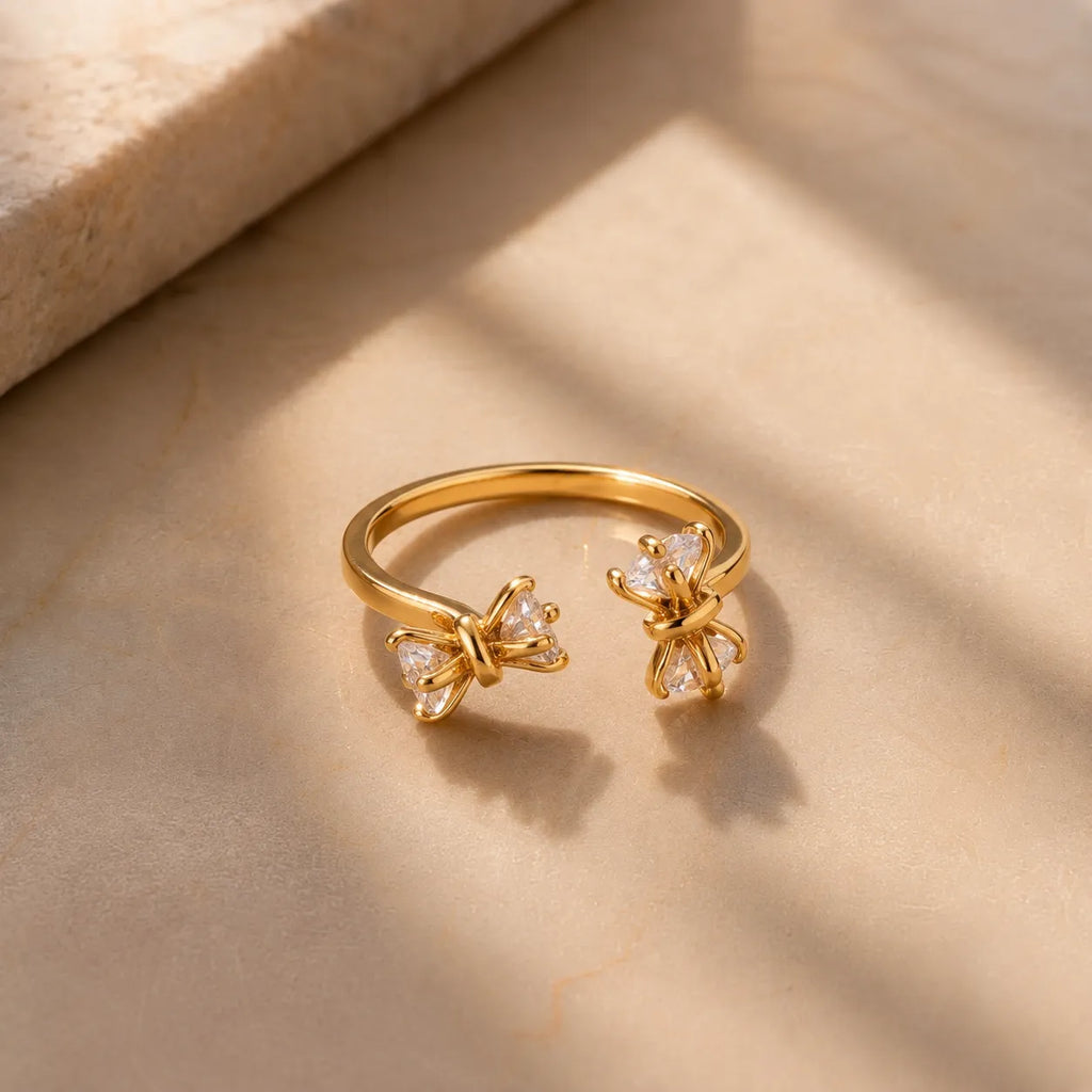 Marvel Silver gold plated adjustable double bow ring for girls featuring sparkling triangle-cut cubic zirconia stones in an elegant open-band design.