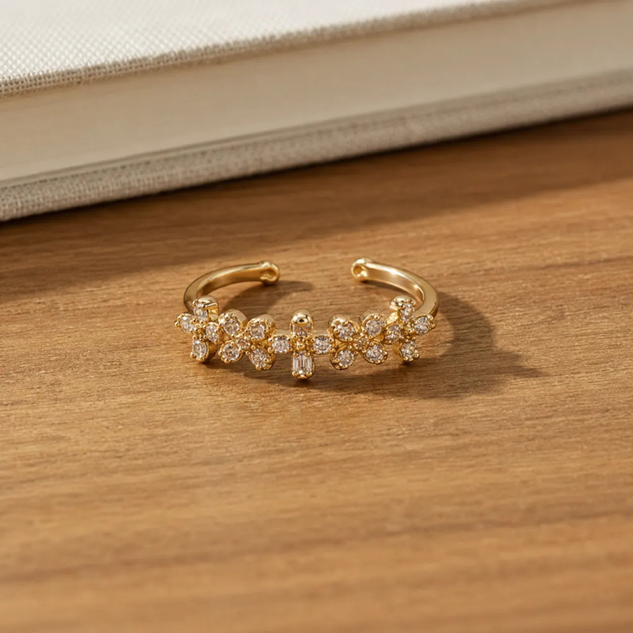 Marvel Silver gold plated adjustable floral crystal ring for girls featuring sparkling flower-shaped cubic zirconia stones in an elegant open-band design.