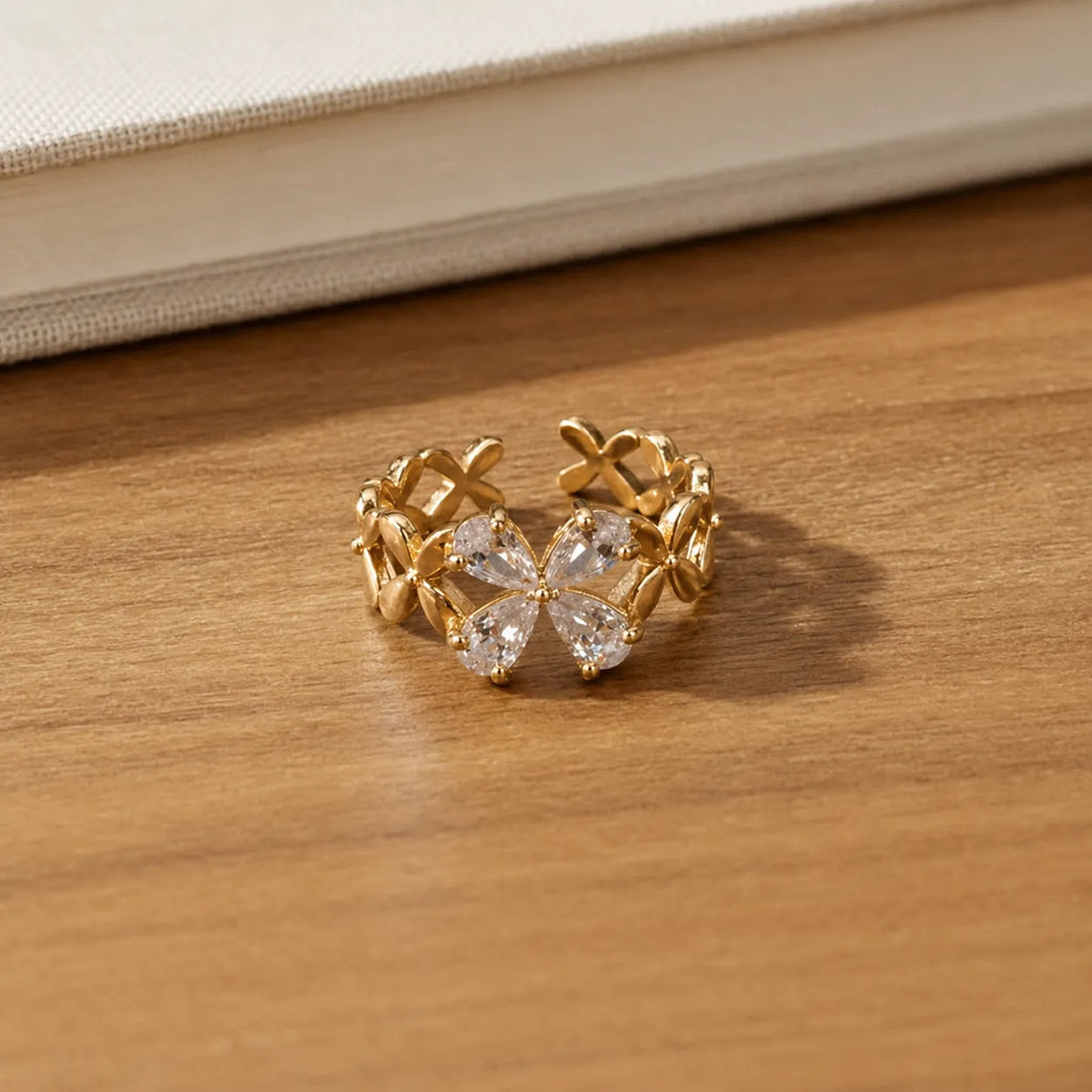 Marvel Silver gold plated floral adjustable ring for girls featuring sparkling pear-cut cubic zirconia stones in an elegant flower-inspired design.