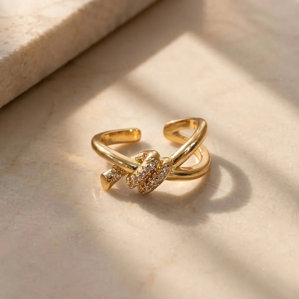 Marvel Silver gold plated adjustable knot imitation ring featuring sparkling cubic zirconia stones for women and girls.