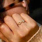 Marvel Silver gold plated adjustable teardrop crystal ring for girls featuring a sparkling open-band design with cubic zirconia stones.