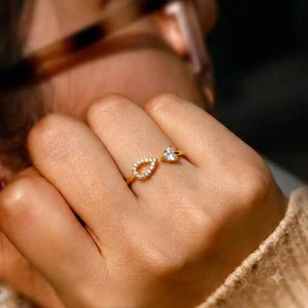 Marvel Silver gold plated adjustable teardrop crystal ring for girls featuring a sparkling open-band design with cubic zirconia stones.
