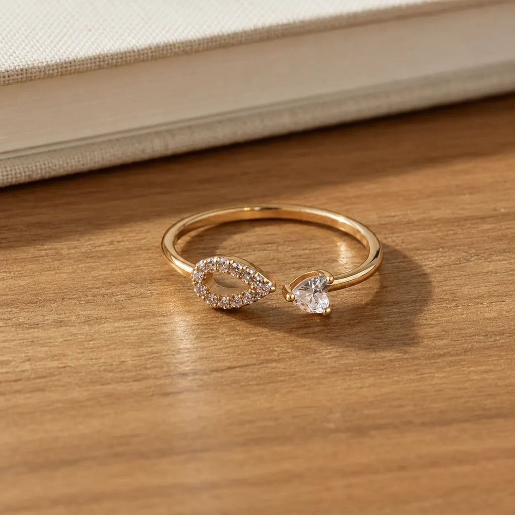 Marvel Silver gold plated adjustable teardrop crystal ring for girls featuring a sparkling open-band design with cubic zirconia stones.