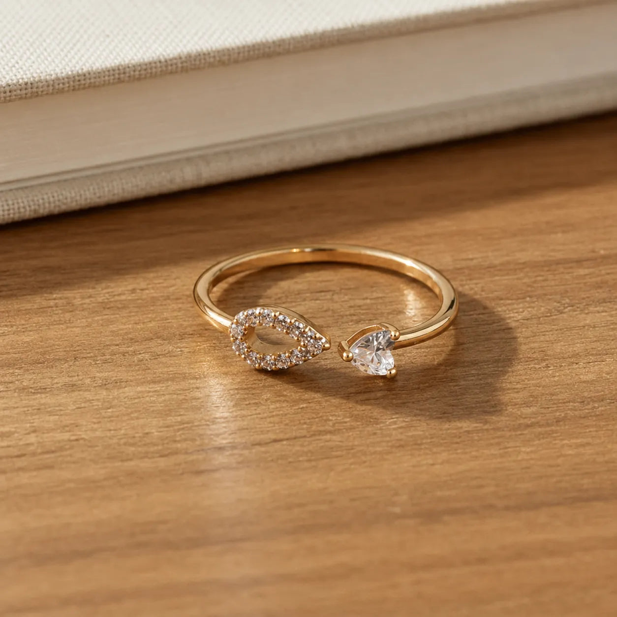 Marvel Silver gold plated adjustable teardrop crystal ring for girls featuring a sparkling open-band design with cubic zirconia stones.