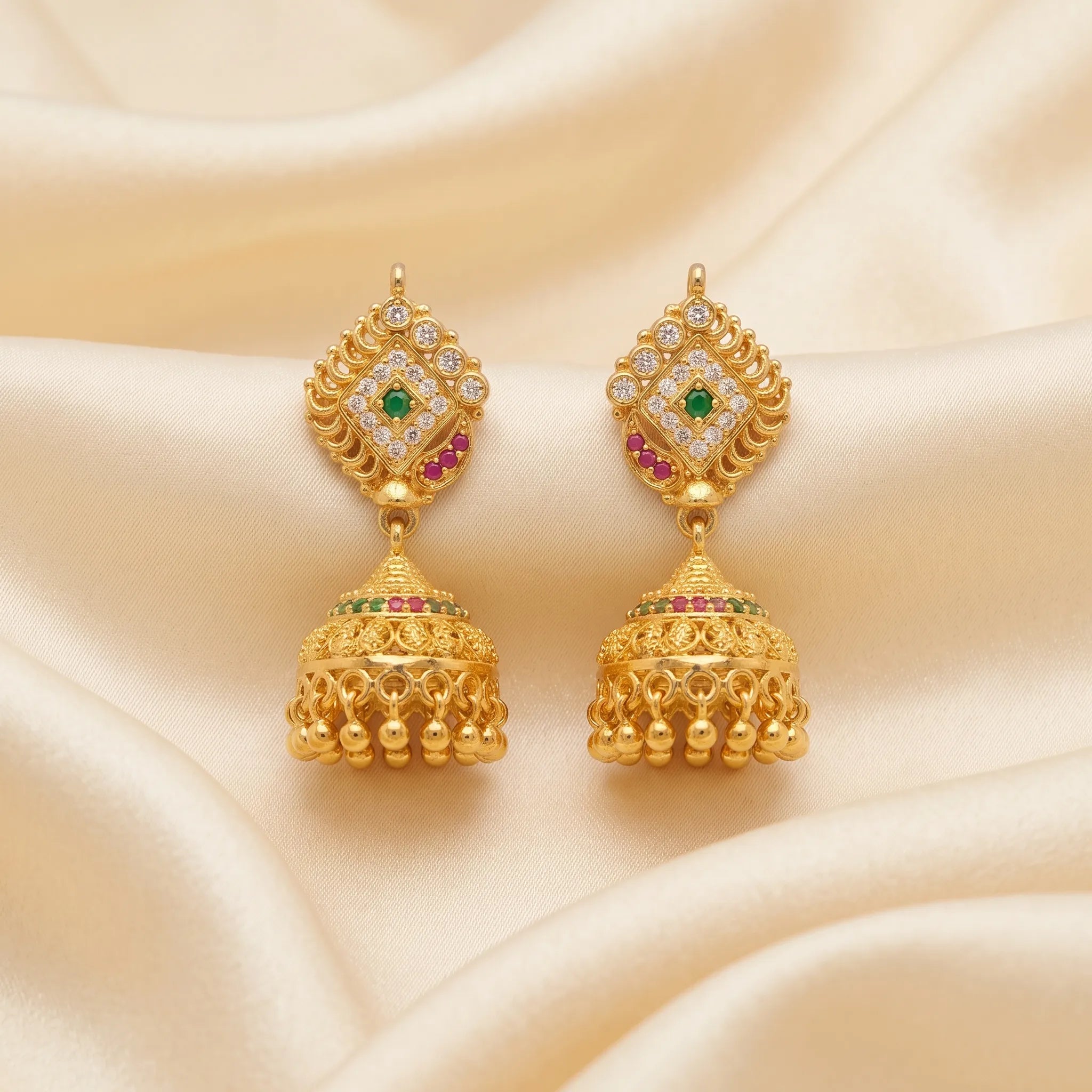 Gold polish green stone traditional jhumka earrings with pink and white stones by Marvel Silver