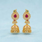Gold polish ruby stone traditional jhumka earrings with white stones and hanging gold beads by Marvel Silver
