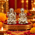 Marvel Silver Lakshmi Ganesh Silver Idol Set Featuring Lord Ganesha and Goddess Lakshmi Seated on Decorative Lotus Bases for Diwali Puja