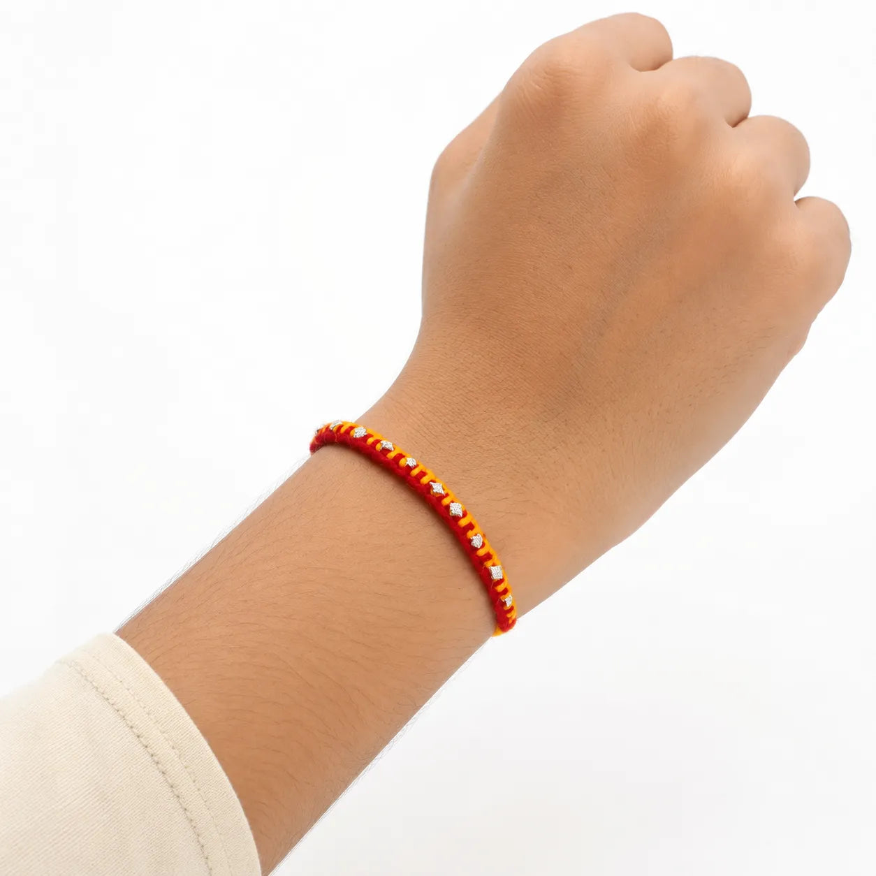 Marvel Silver yellow red rakhi with mixed floral and geometric silver-tone decorative motifs