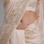 Marvel Silver Multicolor Heart Charm Silver Waist Chain Kamarband Worn by Woman with Cream Embroidered Saree, Featuring Colourful Heart-Shaped Charms and Delicate Silver Bead Detailing