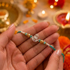 Marvel Silver Om Damru Silver Rakhi with Green Crystal Beads, White Pearl Beads and Silver Om Damru Symbol for Raksha Bandhan