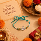 Marvel Silver Om Damru Silver Rakhi with Green Crystal Beads, White Pearl Beads and Silver Om Damru Symbol for Raksha Bandhan