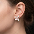 Marvel Silver pink and white floral enamel imitation stud earrings with CZ stones and gold-tone finish for women.