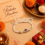 Marvel Silver Ram Name Silver Rakhi with White Pearl Beads, Purple CZ Stone Charm and Designer Thread for Raksha Bandhan