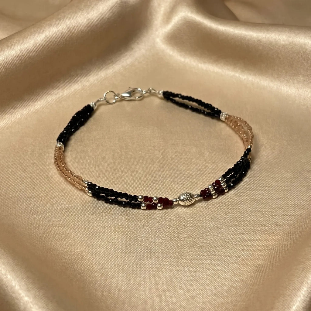 Marvel Silver Royal Black and Rose Gold Layered Silver Anklet for women with black beads, rose gold tone beads, red accents and silver detailing
