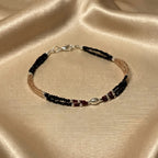 Marvel Silver Royal Black and Rose Gold Layered Silver Anklet for women with black beads, rose gold tone beads, red accents and silver detailing