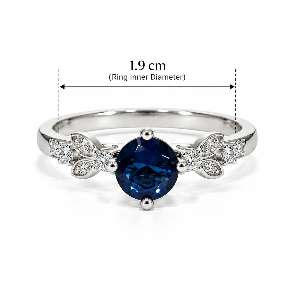 Marvel Silver Royal Blue Sapphire Leaf Accent Silver Ring with round blue center stone and sparkling white leaf detailing