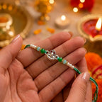 Marvel Silver Shiv Ling Silver Rakhi with Green Crystal Beads, White Pearl Beads and Sparkling Shiv Ling Charm for Raksha Bandhan