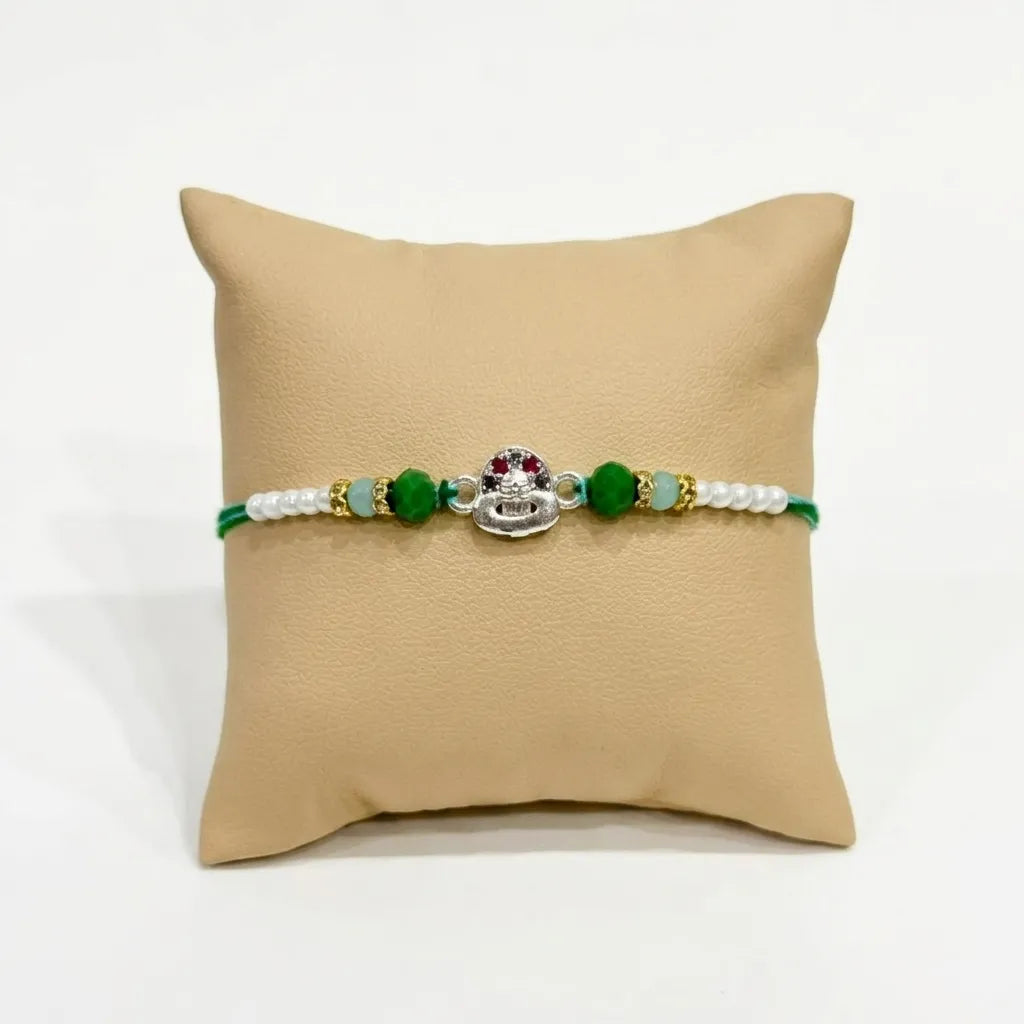 Marvel Silver Shiv Ling Silver Rakhi with Green Crystal Beads, White Pearl Beads and Sparkling Shiv Ling Charm for Raksha Bandhan