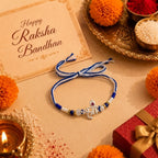 Marvel Silver Shree Silver Rakhi with Blue Beads, White Crystal Beads, Pearl Beads and Red CZ Stone for Raksha Bandhan