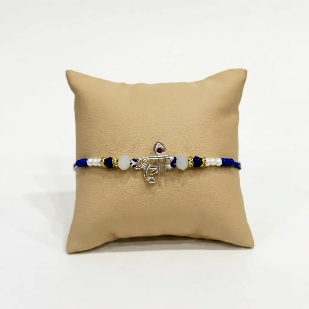 Marvel Silver Shree Silver Rakhi with Blue Beads, White Crystal Beads, Pearl Beads and Red CZ Stone for Raksha Bandhan