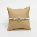 Marvel Silver Shree Silver Rakhi with White Crystal Beads, White Pearl Beads and Sparkling Silver Shree Symbol for Raksha Bandhan