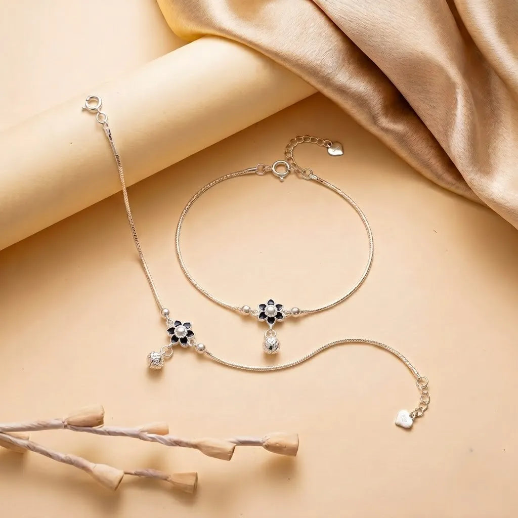 Marvel Silver adjustable silver anklet for women with black floral design and sparkling hanging drop charm