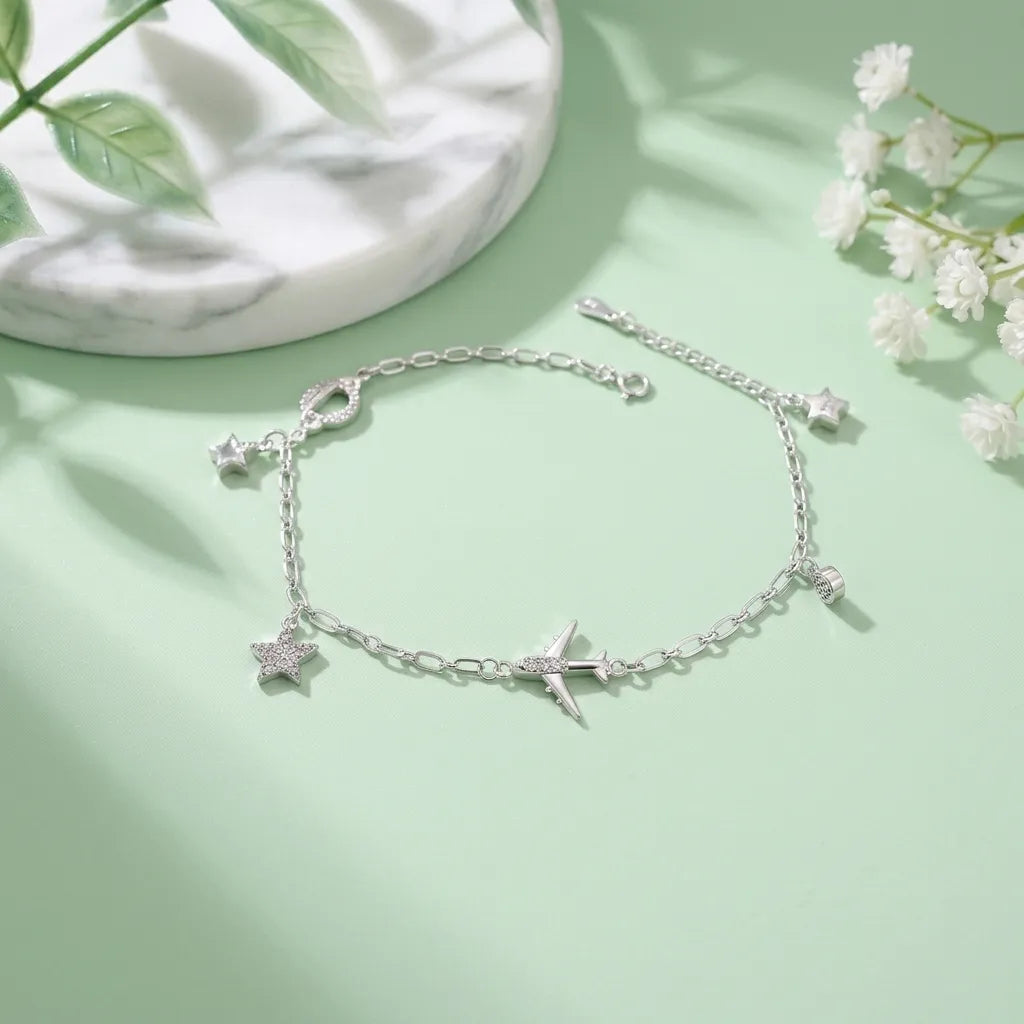 Marvel Silver Airplane Charm Anklet featuring silver chain with airplane, star charms, and adjustable clasp for women and girls.