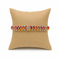 Marvel Silver Silver Bead Flower Designer Rakhi featuring a handcrafted floral silver bead centerpiece with red and yellow braided thread for Raksha Bandhan.