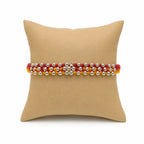Marvel Silver Silver Bead Flower Designer Rakhi featuring a handcrafted floral silver bead centerpiece with red and yellow braided thread for Raksha Bandhan.
