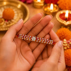 Marvel Silver Silver Bead Flower Designer Rakhi featuring a handcrafted floral silver bead centerpiece with red and yellow braided thread for Raksha Bandhan.