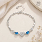 Marvel Silver 925 sterling silver bracelet featuring a sparkling heart-shaped CZ centerpiece with vibrant blue gemstones and an adjustable chain, designed for women and girls, perfect for daily wear, office, parties, weddings, festive occasions, and gifting.