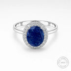Marvel Silver blue oval stone halo silver ring for women with sparkling white stones