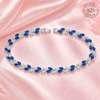 Marvel Silver blue stone leaf design silver bracelet for women with sparkling white stones