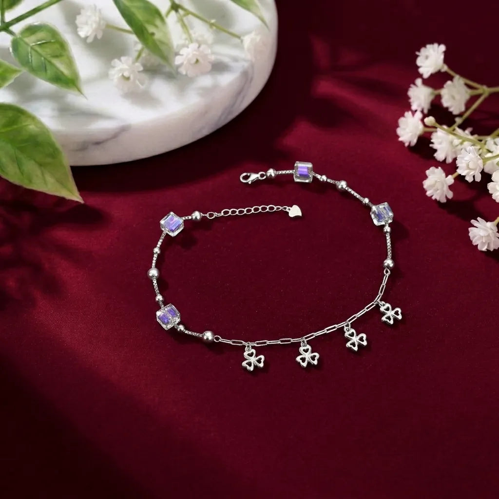 Marvel Silver Clover Charm Anklet featuring sparkling crystal cube beads, polished silver beads, dangling four-leaf clover charms, and an adjustable extension chain for women and girls.