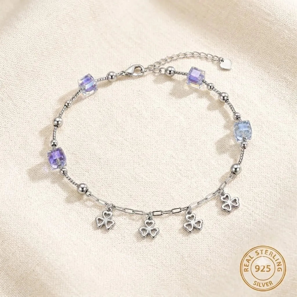Marvel Silver Clover Charm Anklet featuring sparkling crystal cube beads, polished silver beads, dangling four-leaf clover charms, and an adjustable extension chain for women and girls.