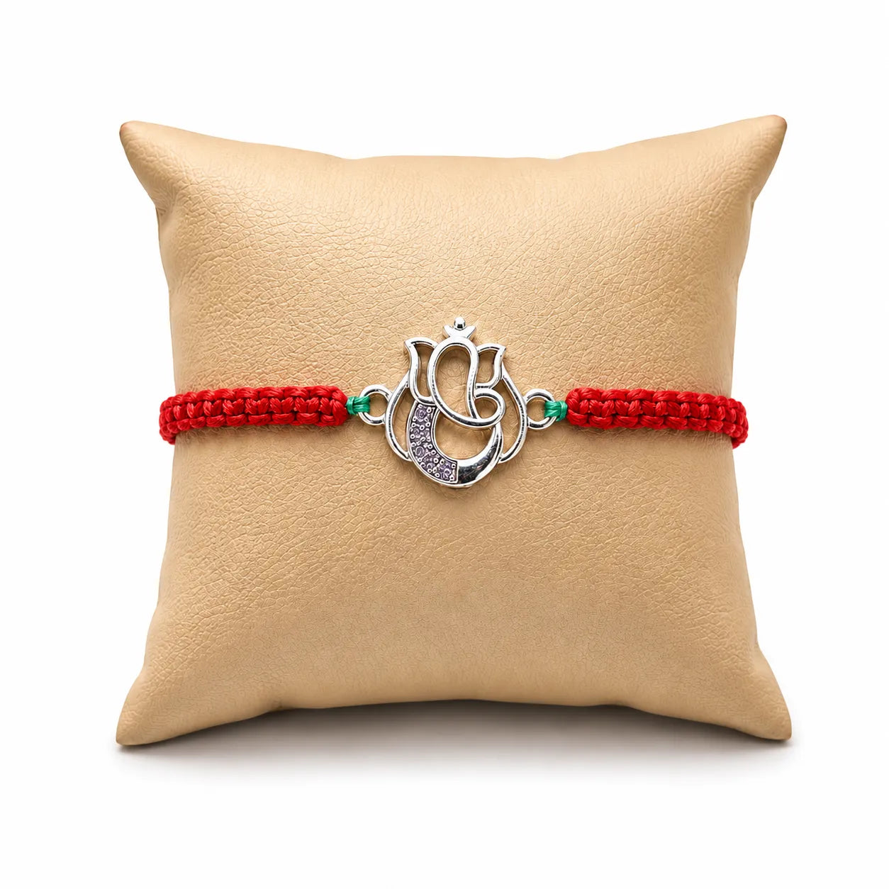 Marvel Silver Designer Ganesh Rakhi with silver-finish Lord Ganesha charm, pink braided thread, and sparkling stone detailing for Raksha Bandhan.