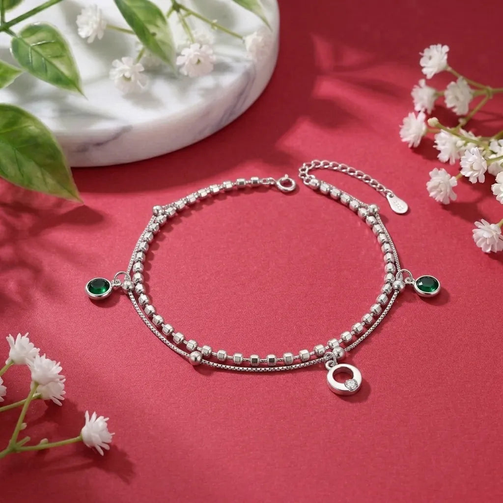 Marvel Silver Emerald Charm Anklet with green crystal charms, silver double chain, and adjustable clasp for women and girls.