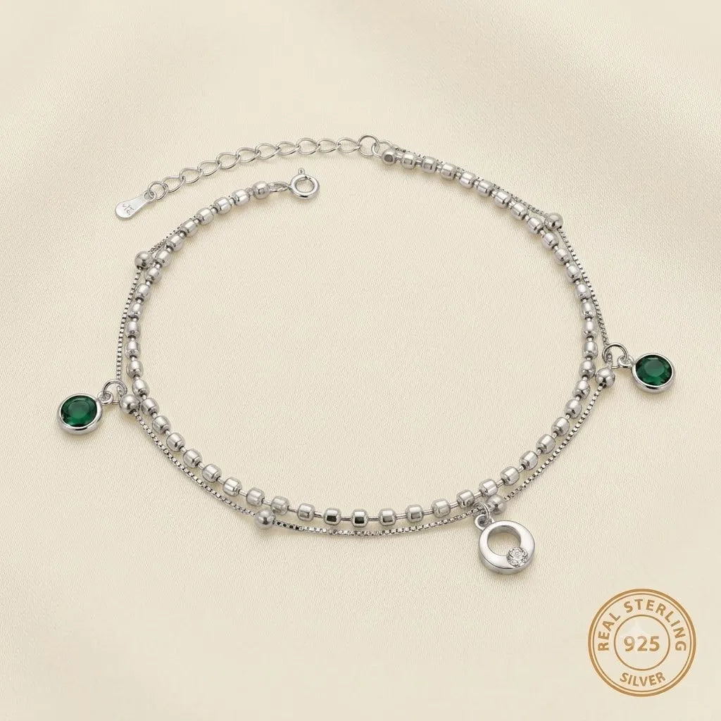 Marvel Silver Emerald Charm Anklet with green crystal charms, silver double chain, and adjustable clasp for women and girls.