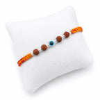 Marvel Silver Evil Eye Rudraksha Rakhi with polished silver beads on a saffron and red braided thread