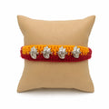 Marvel Silver Ganesh Designer Rakhi featuring four silver-finish Lord Ganesha charms on a handcrafted yellow and maroon braided thread for Raksha Bandhan.