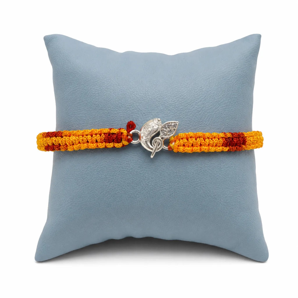 Marvel Silver Ganesh design rakhi with yellow and red braided thread for brother