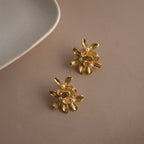 Marvel Silver gold floral imitation stud earrings with elegant pearl accents and premium gold-plated finish for women.