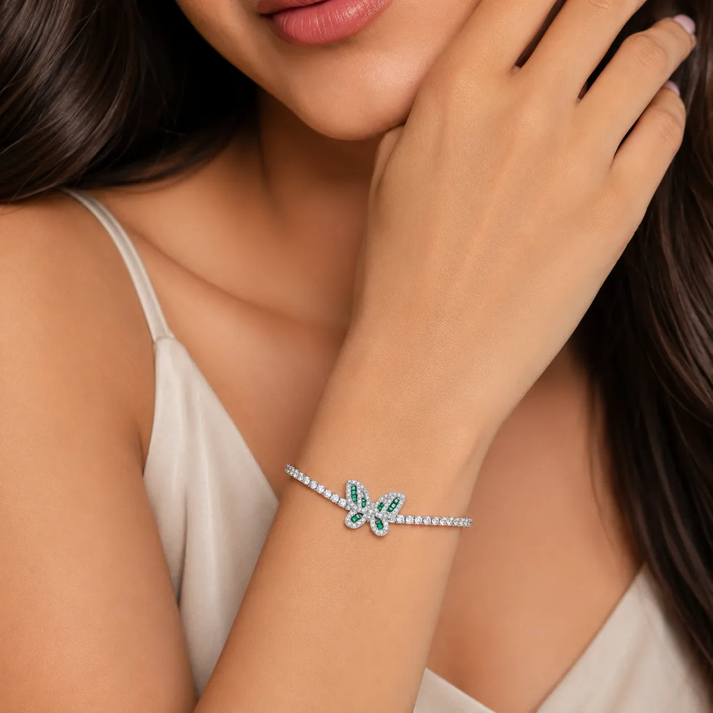 Marvel Silver 925 sterling silver tennis bracelet featuring a sparkling butterfly charm with green and white Cubic Zirconia stones, adjustable chain, elegant silver finish, designed for women and girls, perfect for daily wear, parties, weddings, festive occasions, and gifting.
