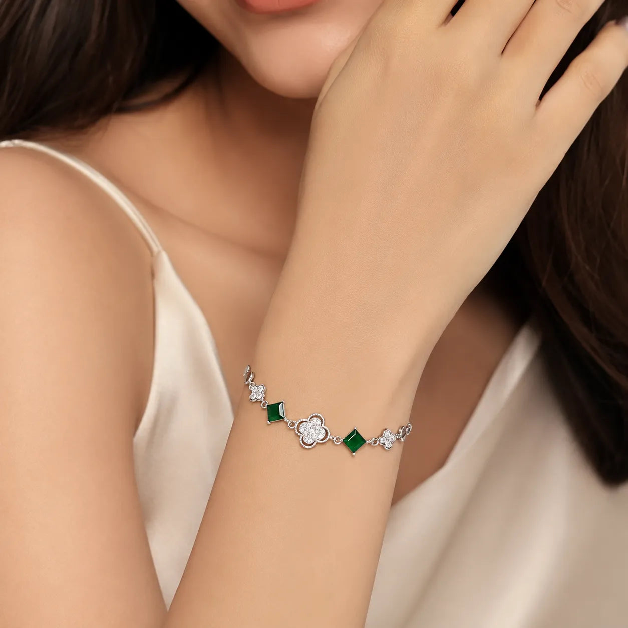Marvel Silver 925 sterling silver bracelet featuring sparkling CZ clover charms, emerald-green square stones, and an adjustable chain, designed for women and girls, perfect for daily wear, office, parties, weddings, festive occasions, and gifting.