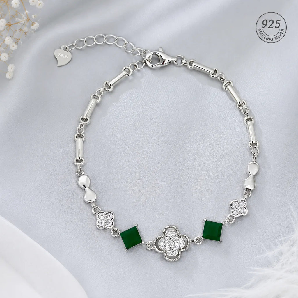 Marvel Silver 925 sterling silver bracelet featuring sparkling CZ clover charms, emerald-green square stones, and an adjustable chain, designed for women and girls, perfect for daily wear, office, parties, weddings, festive occasions, and gifting.