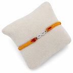 Marvel Silver infinity design rakhi for brother with yellow red braided thread and silver-tone stone-studded infinity charm