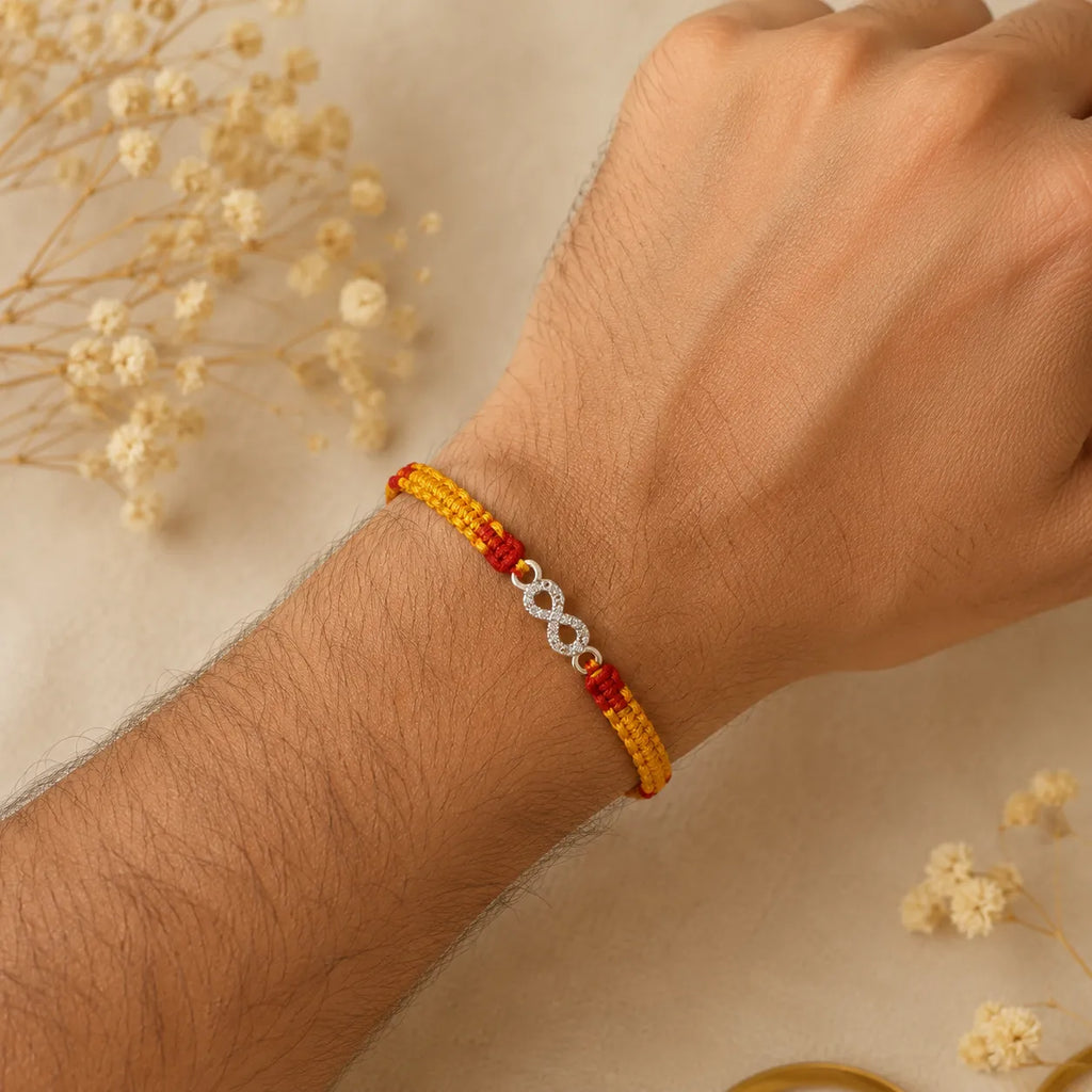 Marvel Silver infinity design rakhi for brother with yellow red braided thread and silver-tone stone-studded infinity charm